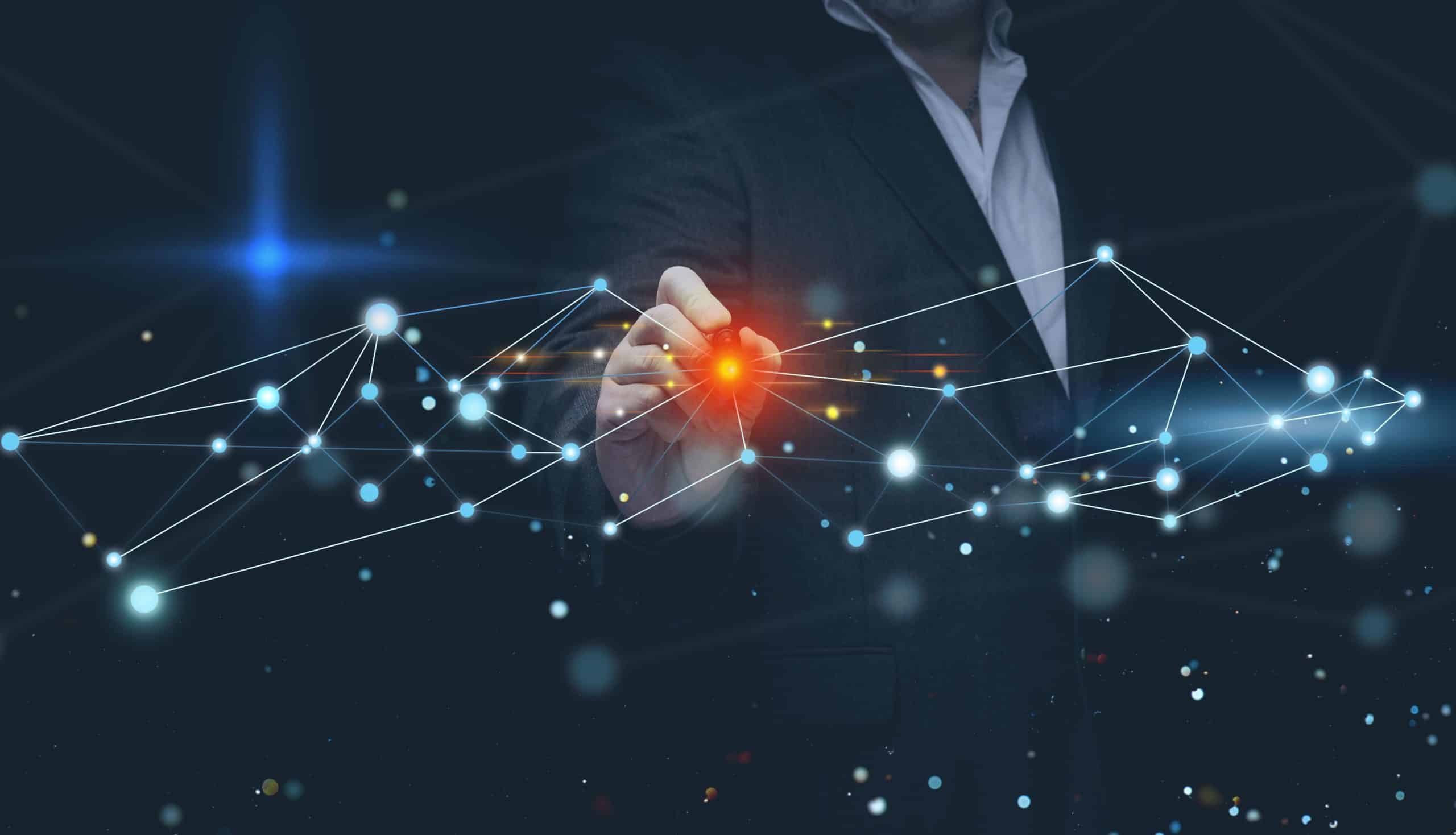 Eine Person in einem Anzug berührt einen rot leuchtenden Punkt in einem digitalen Netz aus miteinander verbundenen Linien und Knoten, die Technologie, Daten oder Innovation auf einem dunklen Hintergrund darstellen.